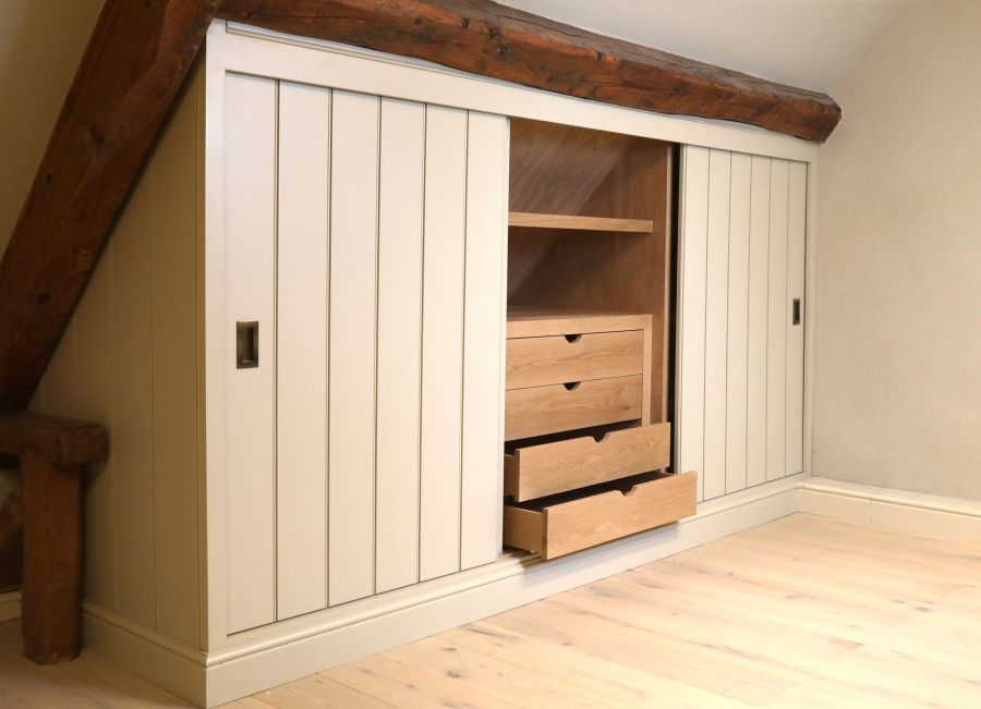 Sloped attic storage cabinet